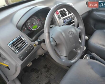 Черный Хендай Туксон, объемом двигателя 2 л и пробегом 208 тыс. км за 6950 $, фото 12 на Automoto.ua