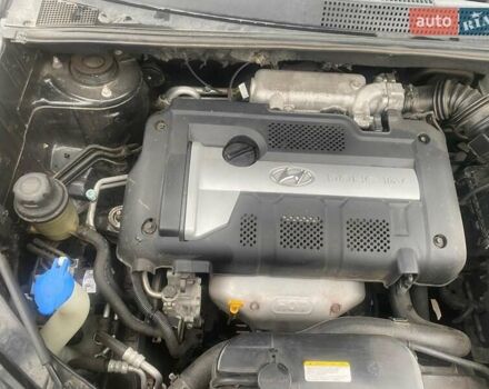 Черный Хендай Туксон, объемом двигателя 2 л и пробегом 190 тыс. км за 7500 $, фото 19 на Automoto.ua