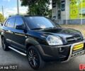 Черный Хендай Туксон, объемом двигателя 2 л и пробегом 241 тыс. км за 7800 $, фото 1 на Automoto.ua