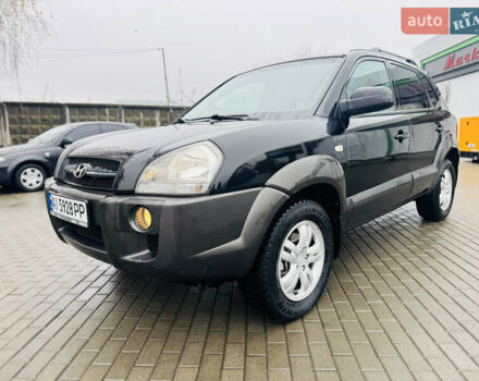 Черный Хендай Туксон, объемом двигателя 1.98 л и пробегом 252 тыс. км за 7300 $, фото 8 на Automoto.ua