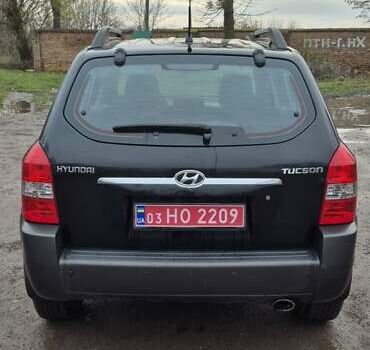 Черный Хендай Туксон, объемом двигателя 1.98 л и пробегом 230 тыс. км за 6390 $, фото 6 на Automoto.ua