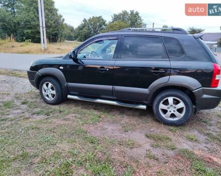 Черный Хендай Туксон, объемом двигателя 1.99 л и пробегом 250 тыс. км за 6650 $, фото 1 на Automoto.ua