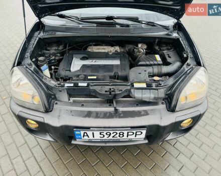 Черный Хендай Туксон, объемом двигателя 1.98 л и пробегом 252 тыс. км за 7300 $, фото 26 на Automoto.ua