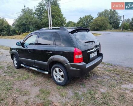 Черный Хендай Туксон, объемом двигателя 1.99 л и пробегом 250 тыс. км за 6650 $, фото 3 на Automoto.ua