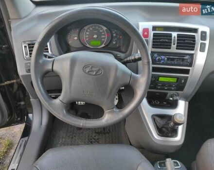 Черный Хендай Туксон, объемом двигателя 2 л и пробегом 208 тыс. км за 6950 $, фото 21 на Automoto.ua