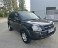 Черный Хендай Туксон, объемом двигателя 2 л и пробегом 290 тыс. км за 4000 $, фото 1 на Automoto.ua