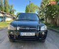 Черный Хендай Туксон, объемом двигателя 2 л и пробегом 232 тыс. км за 6900 $, фото 1 на Automoto.ua