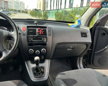 Черный Хендай Туксон, объемом двигателя 2 л и пробегом 255 тыс. км за 6900 $, фото 16 на Automoto.ua