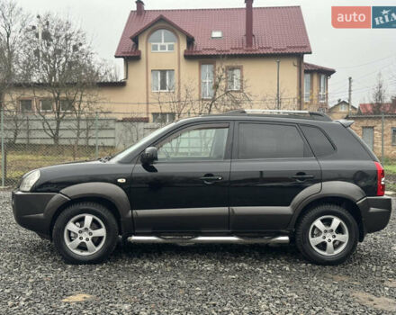 Черный Хендай Туксон, объемом двигателя 2 л и пробегом 257 тыс. км за 6800 $, фото 10 на Automoto.ua