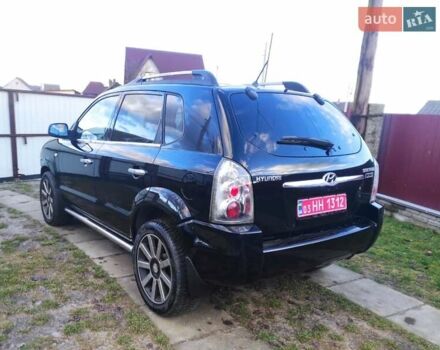 Черный Хендай Туксон, объемом двигателя 2 л и пробегом 208 тыс. км за 6950 $, фото 41 на Automoto.ua