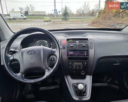 Черный Хендай Туксон, объемом двигателя 2 л и пробегом 170 тыс. км за 6999 $, фото 10 на Automoto.ua