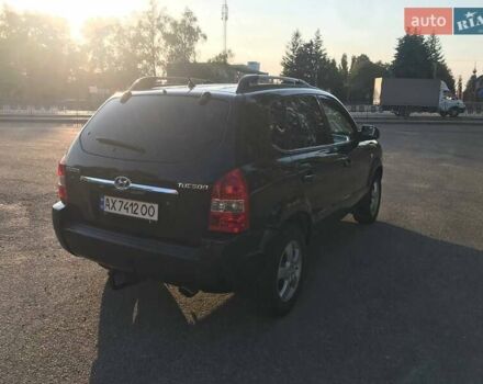 Черный Хендай Туксон, объемом двигателя 2 л и пробегом 253 тыс. км за 7500 $, фото 3 на Automoto.ua
