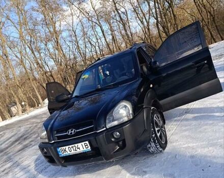 Черный Хендай Туксон, объемом двигателя 1.98 л и пробегом 285 тыс. км за 5600 $, фото 12 на Automoto.ua