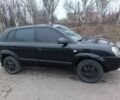 Черный Хендай Туксон, объемом двигателя 2 л и пробегом 293 тыс. км за 4300 $, фото 1 на Automoto.ua