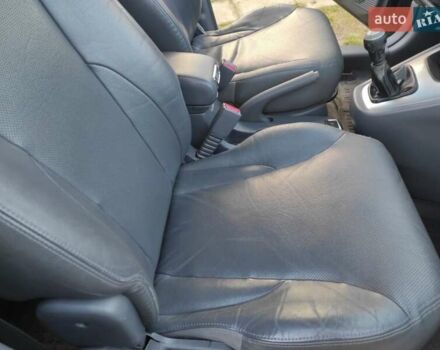 Черный Хендай Туксон, объемом двигателя 2 л и пробегом 208 тыс. км за 6950 $, фото 27 на Automoto.ua