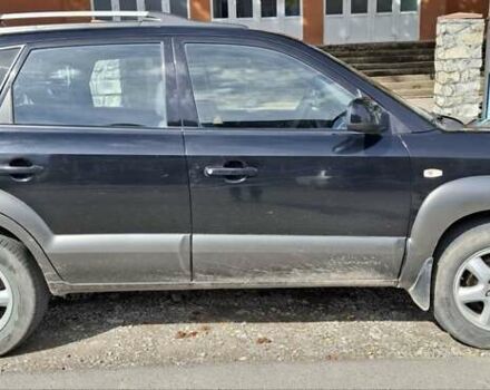 Черный Хендай Туксон, объемом двигателя 1.98 л и пробегом 193 тыс. км за 8000 $, фото 1 на Automoto.ua