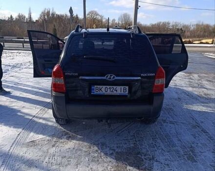 Черный Хендай Туксон, объемом двигателя 1.98 л и пробегом 285 тыс. км за 5600 $, фото 20 на Automoto.ua