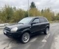 Черный Хендай Туксон, объемом двигателя 2 л и пробегом 230 тыс. км за 7500 $, фото 1 на Automoto.ua