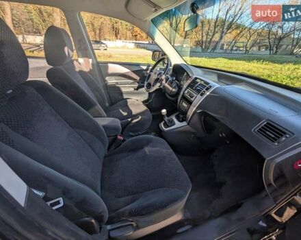 Черный Хендай Туксон, объемом двигателя 1.98 л и пробегом 226 тыс. км за 6500 $, фото 7 на Automoto.ua