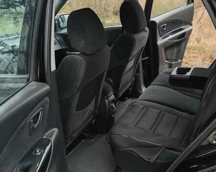 Черный Хендай Туксон, объемом двигателя 2 л и пробегом 284 тыс. км за 4700 $, фото 13 на Automoto.ua