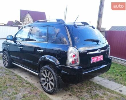 Черный Хендай Туксон, объемом двигателя 2 л и пробегом 208 тыс. км за 6950 $, фото 42 на Automoto.ua