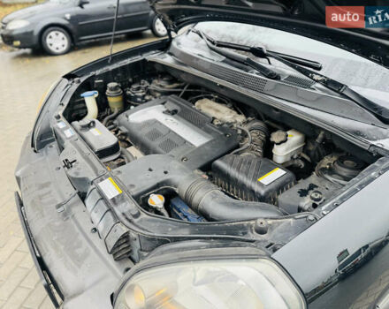 Черный Хендай Туксон, объемом двигателя 1.98 л и пробегом 252 тыс. км за 7300 $, фото 27 на Automoto.ua