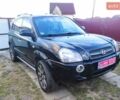 Черный Хендай Туксон, объемом двигателя 2 л и пробегом 208 тыс. км за 6950 $, фото 1 на Automoto.ua