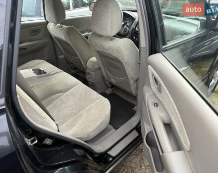 Черный Хендай Туксон, объемом двигателя 2 л и пробегом 211 тыс. км за 4444 $, фото 16 на Automoto.ua