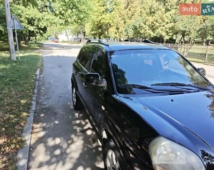 Черный Хендай Туксон, объемом двигателя 2 л и пробегом 247 тыс. км за 6300 $, фото 5 на Automoto.ua