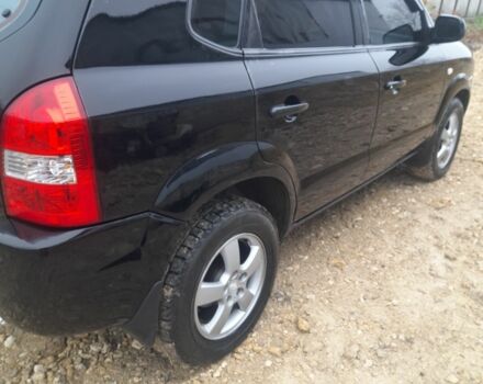 Черный Хендай Туксон, объемом двигателя 2 л и пробегом 230 тыс. км за 6800 $, фото 4 на Automoto.ua