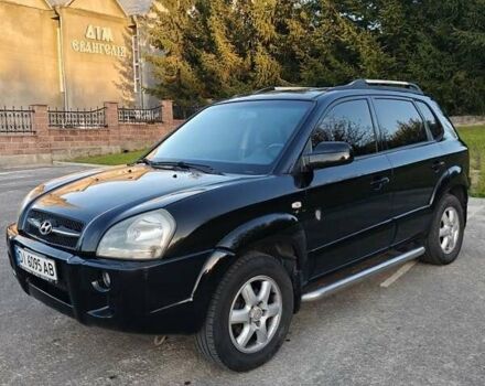 Черный Хендай Туксон, объемом двигателя 2 л и пробегом 235 тыс. км за 6700 $, фото 2 на Automoto.ua