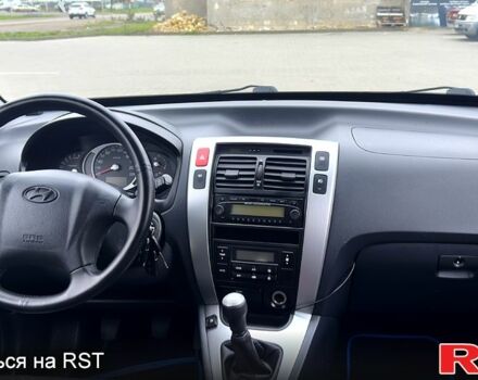 Черный Хендай Туксон, объемом двигателя 2 л и пробегом 200 тыс. км за 7800 $, фото 10 на Automoto.ua
