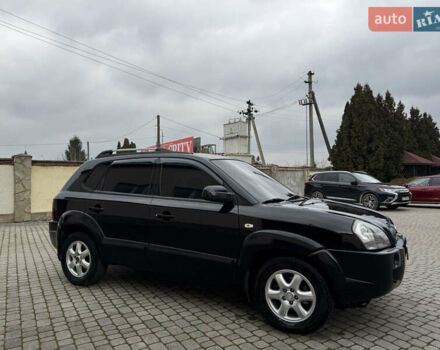 Черный Хендай Туксон, объемом двигателя 1.98 л и пробегом 250 тыс. км за 7150 $, фото 3 на Automoto.ua