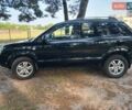 Черный Хендай Туксон, объемом двигателя 1.98 л и пробегом 279 тыс. км за 7800 $, фото 1 на Automoto.ua