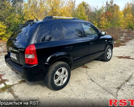 Черный Хендай Туксон, объемом двигателя 2 л и пробегом 250 тыс. км за 7500 $, фото 6 на Automoto.ua