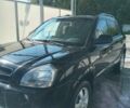 Черный Хендай Туксон, объемом двигателя 1.98 л и пробегом 225 тыс. км за 7500 $, фото 4 на Automoto.ua