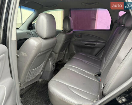 Черный Хендай Туксон, объемом двигателя 1.98 л и пробегом 250 тыс. км за 7150 $, фото 12 на Automoto.ua