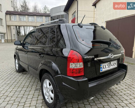 Черный Хендай Туксон, объемом двигателя 1.98 л и пробегом 250 тыс. км за 7150 $, фото 10 на Automoto.ua