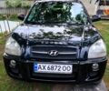 Черный Хендай Туксон, объемом двигателя 2 л и пробегом 266 тыс. км за 8500 $, фото 1 на Automoto.ua