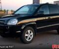 Черный Хендай Туксон, объемом двигателя 2 л и пробегом 138 тыс. км за 7800 $, фото 1 на Automoto.ua