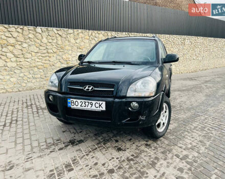 Черный Хендай Туксон, объемом двигателя 1.99 л и пробегом 310 тыс. км за 6600 $, фото 1 на Automoto.ua