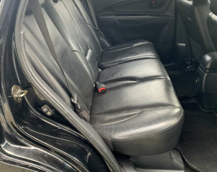 Черный Хендай Туксон, объемом двигателя 1.99 л и пробегом 290 тыс. км за 7700 $, фото 7 на Automoto.ua