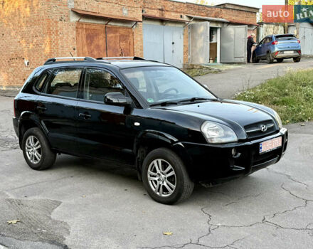 Черный Хендай Туксон, объемом двигателя 2 л и пробегом 189 тыс. км за 7150 $, фото 1 на Automoto.ua