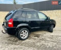 Черный Хендай Туксон, объемом двигателя 1.99 л и пробегом 310 тыс. км за 6600 $, фото 4 на Automoto.ua