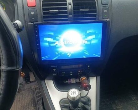 Черный Хендай Туксон, объемом двигателя 2 л и пробегом 220 тыс. км за 8300 $, фото 6 на Automoto.ua