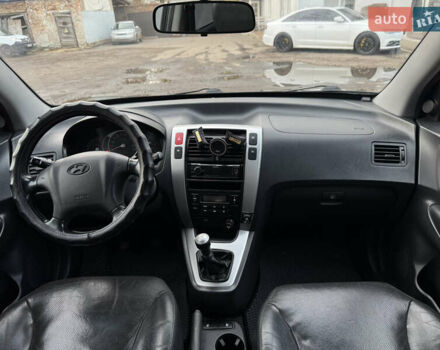 Черный Хендай Туксон, объемом двигателя 1.98 л и пробегом 198 тыс. км за 7500 $, фото 17 на Automoto.ua