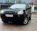 Чорний Хендай Туксон, об'ємом двигуна 1.99 л та пробігом 310 тис. км за 6399 $, фото 1 на Automoto.ua