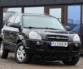 Черный Хендай Туксон, объемом двигателя 2 л и пробегом 263 тыс. км за 7950 $, фото 1 на Automoto.ua