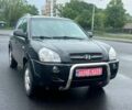 Черный Хендай Туксон, объемом двигателя 1.98 л и пробегом 230 тыс. км за 7800 $, фото 1 на Automoto.ua
