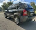 Черный Хендай Туксон, объемом двигателя 2 л и пробегом 249 тыс. км за 5800 $, фото 5 на Automoto.ua